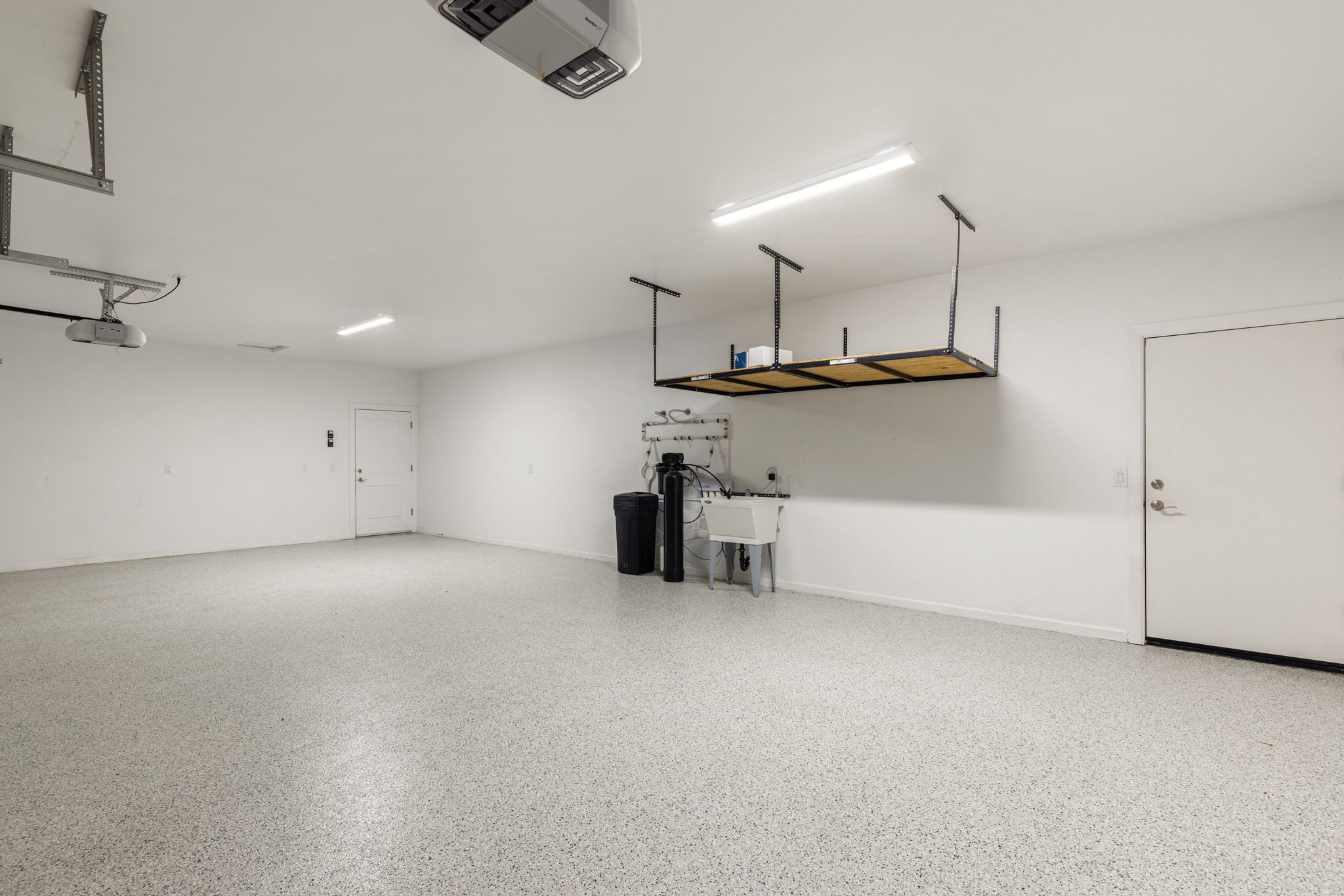 Epoxy floor, overhead storage, man door to backyard