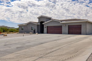 Front Exterior/ Long and extended width concrete driveway
