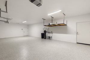 Epoxy floor, overhead storage, man door to backyard