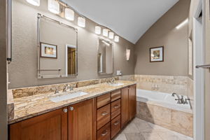 Primary Bathroom with granite counters
