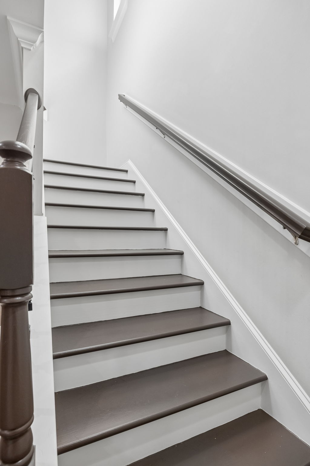 Attractive wooden stair treads with iron-look ballusters.  RECENTLY SANDED AND FINISHED.  UPDATED PICTURES FORTHCOMING.  They are ready for you!