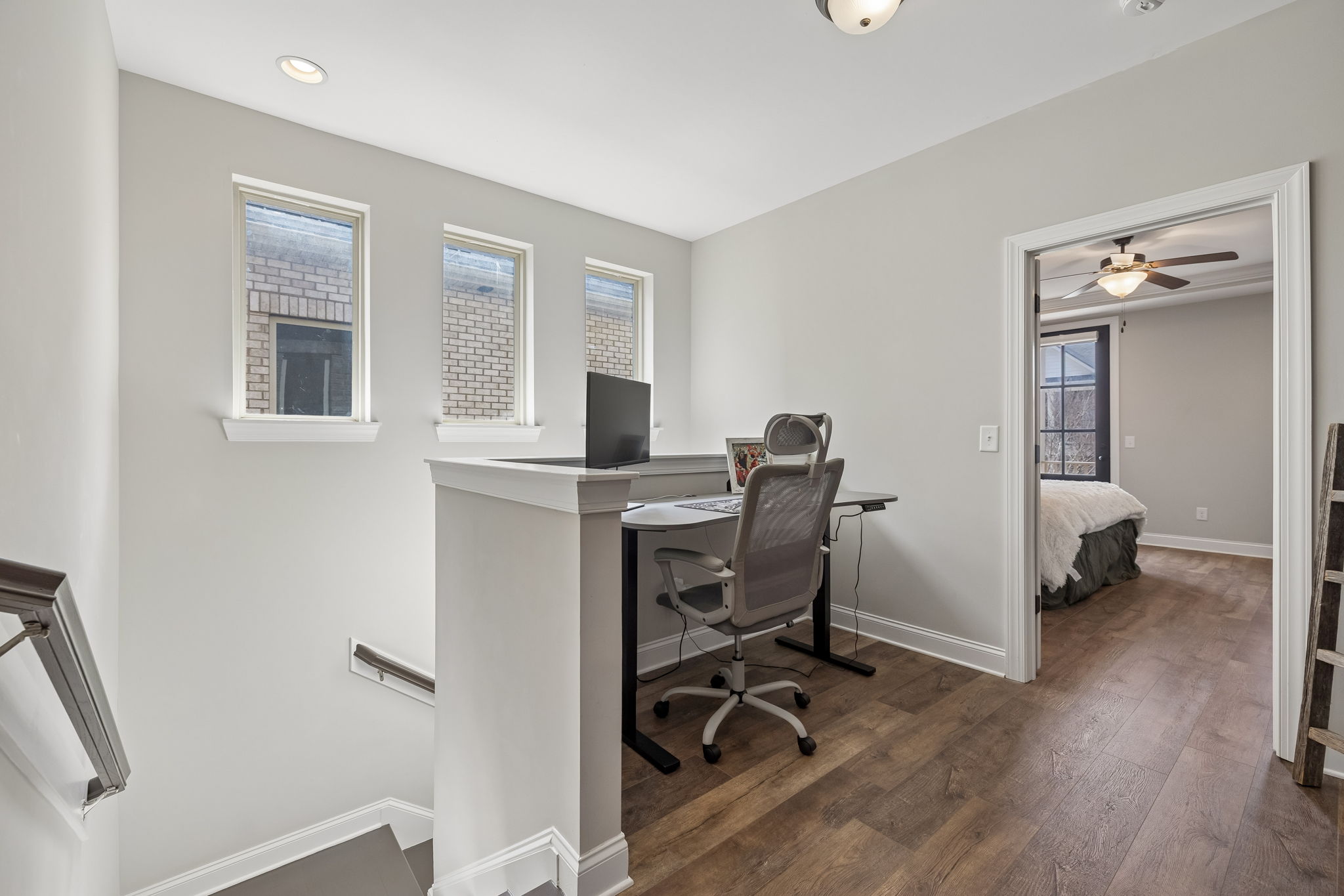 The spacious upstair nook is currently used as office space.  NEW LVP FLOORING RECENTLY INSTALLED IN THIS AREA. (Updated Pictures forthcoming.)