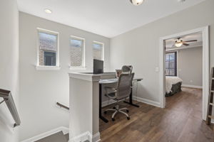 The spacious upstair nook is currently used as office space.  NEW LVP FLOORING RECENTLY INSTALLED IN THIS AREA. (Updated Pictures forthcoming.)