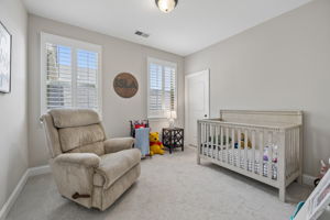 Bedroom 2 with Walk-in-Closet and shutters.