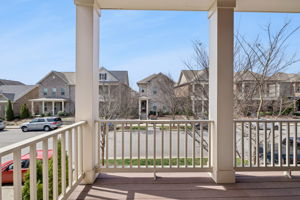 Alternate view from second story balcony, just off the Primary Bedroom suite.  Ready for morning coffee or unwinding in the afternoon with a tall glass of . . . sweet tea!