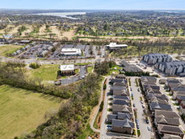 334 Cornelius Way in the front with Hendersonville Public Library shown just above.  The library is adjacent to Drake Creek Park with  beautiful tree-canopied walking trails.