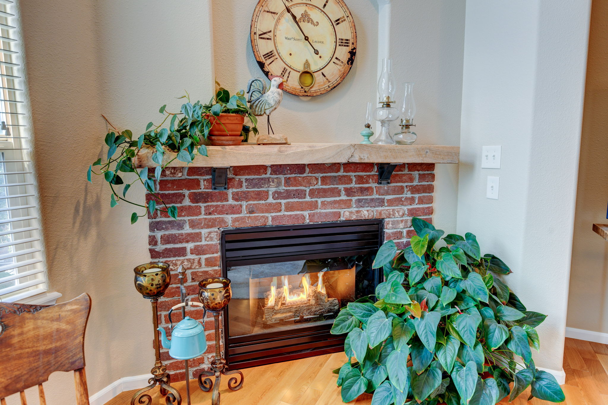 Eye catching fireplace with reclaimed wood mantel.