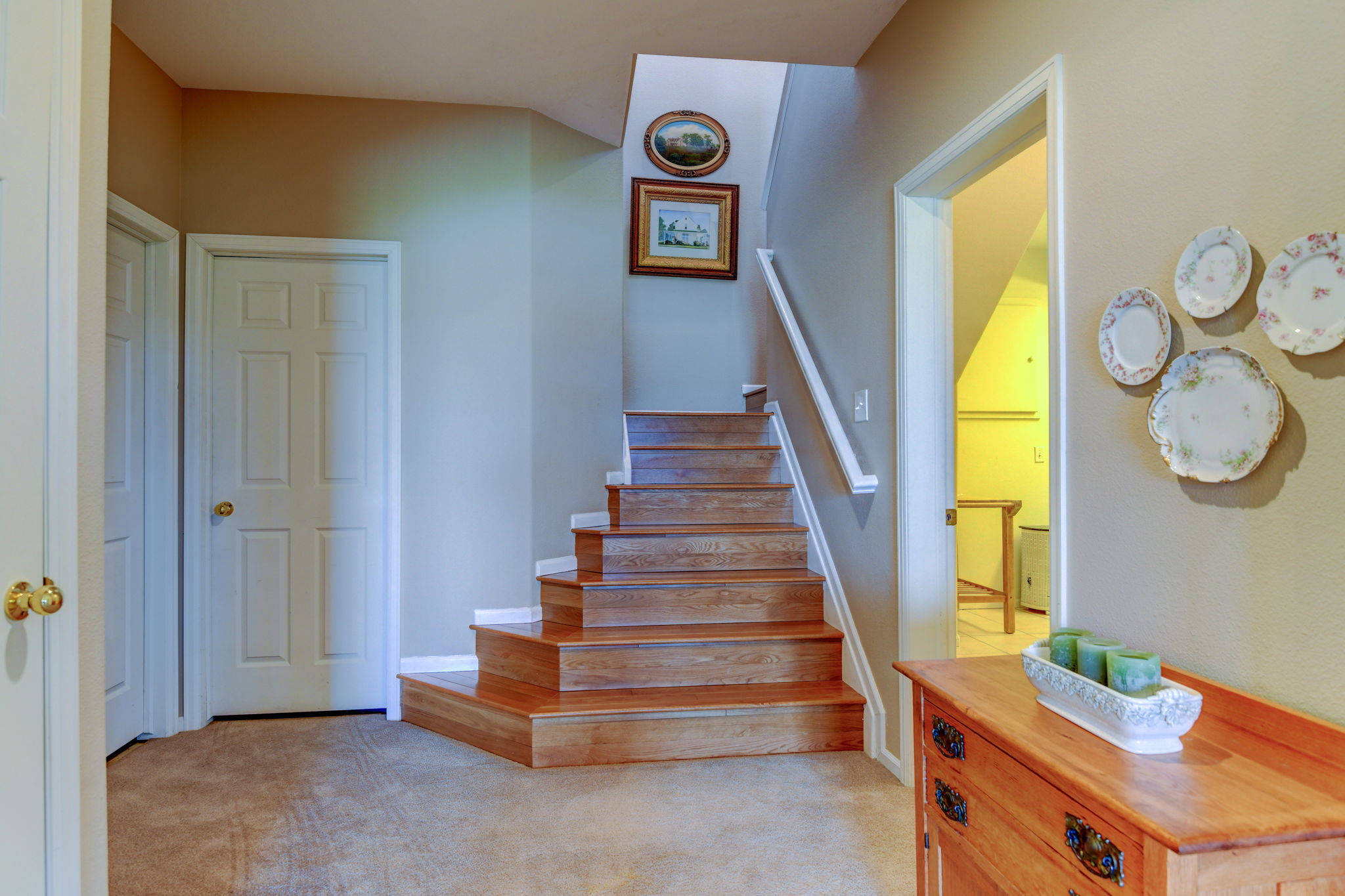 The oak flooring extends to the lower level.