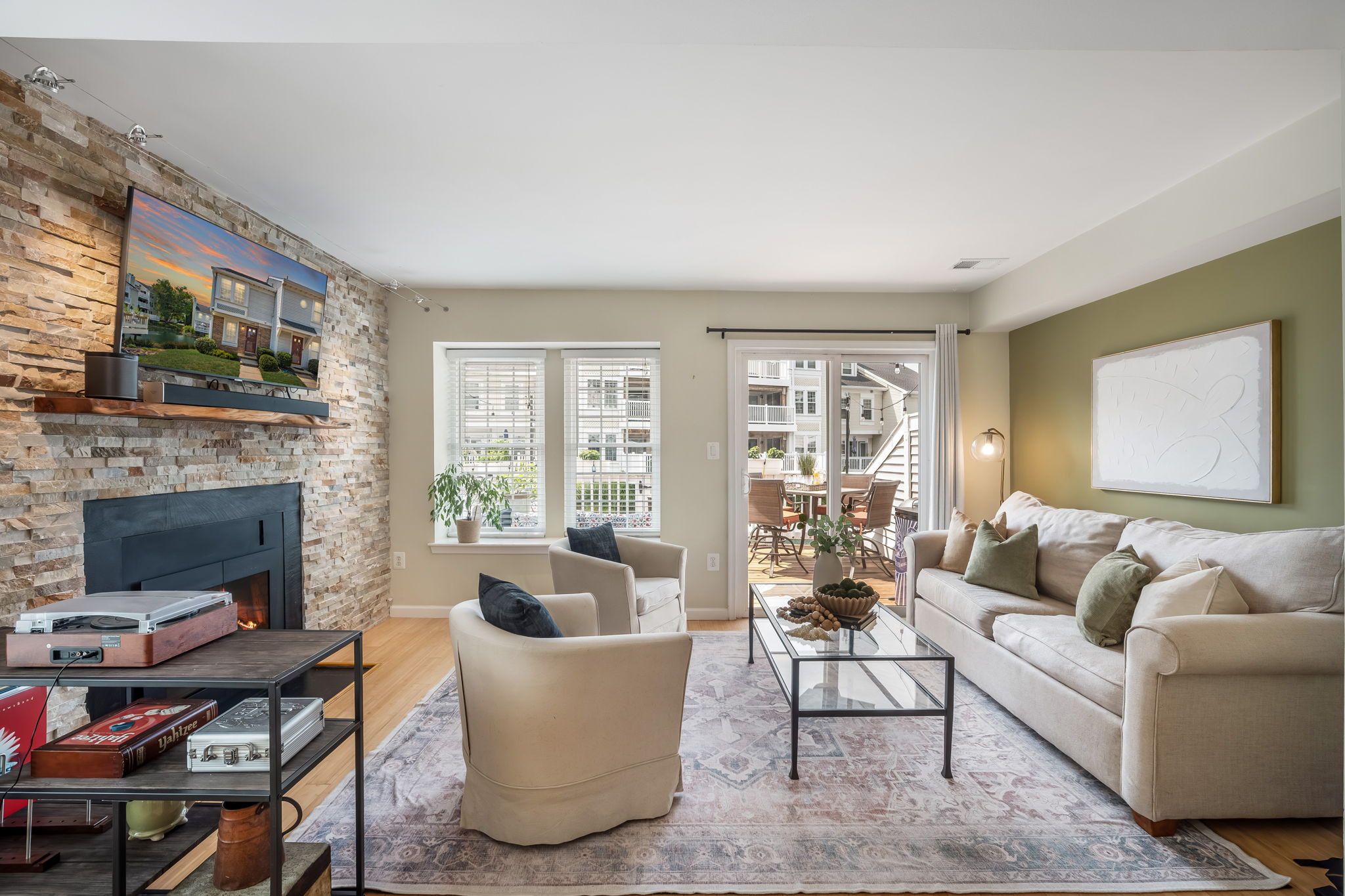 Open Living Room w/modern fireplace & lake views!