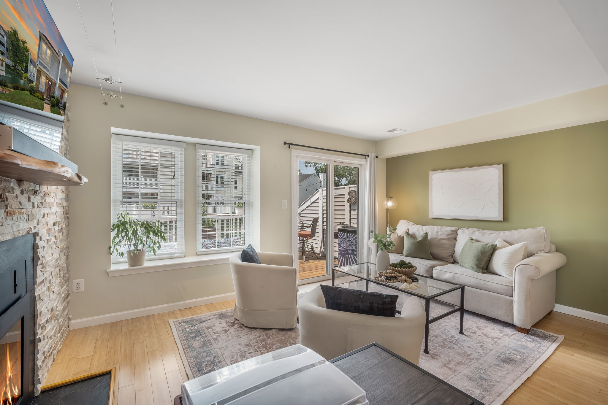 Open Living Room w/modern fireplace & lake views!