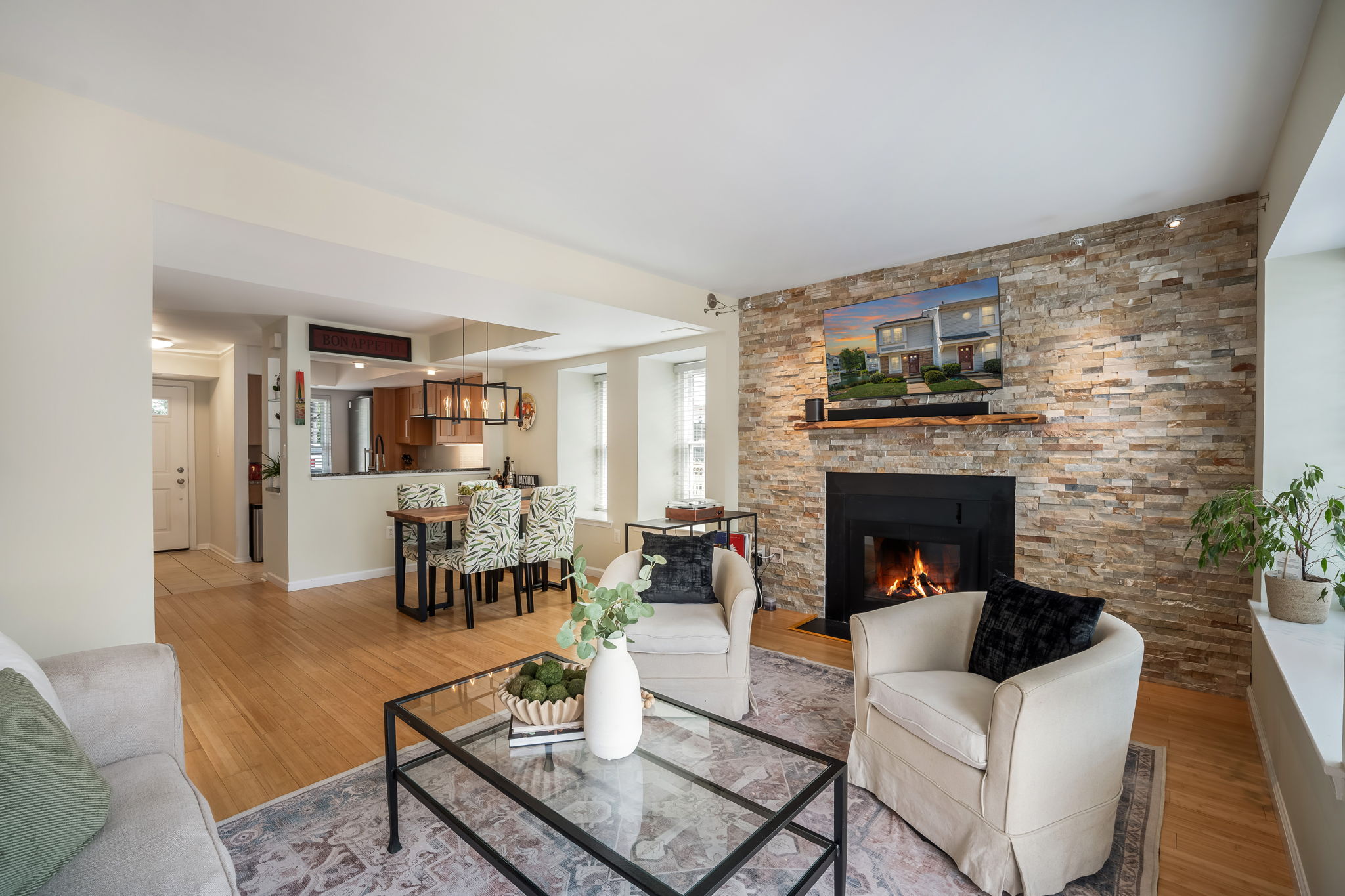 Open Living Room w/modern fireplace & lake views!