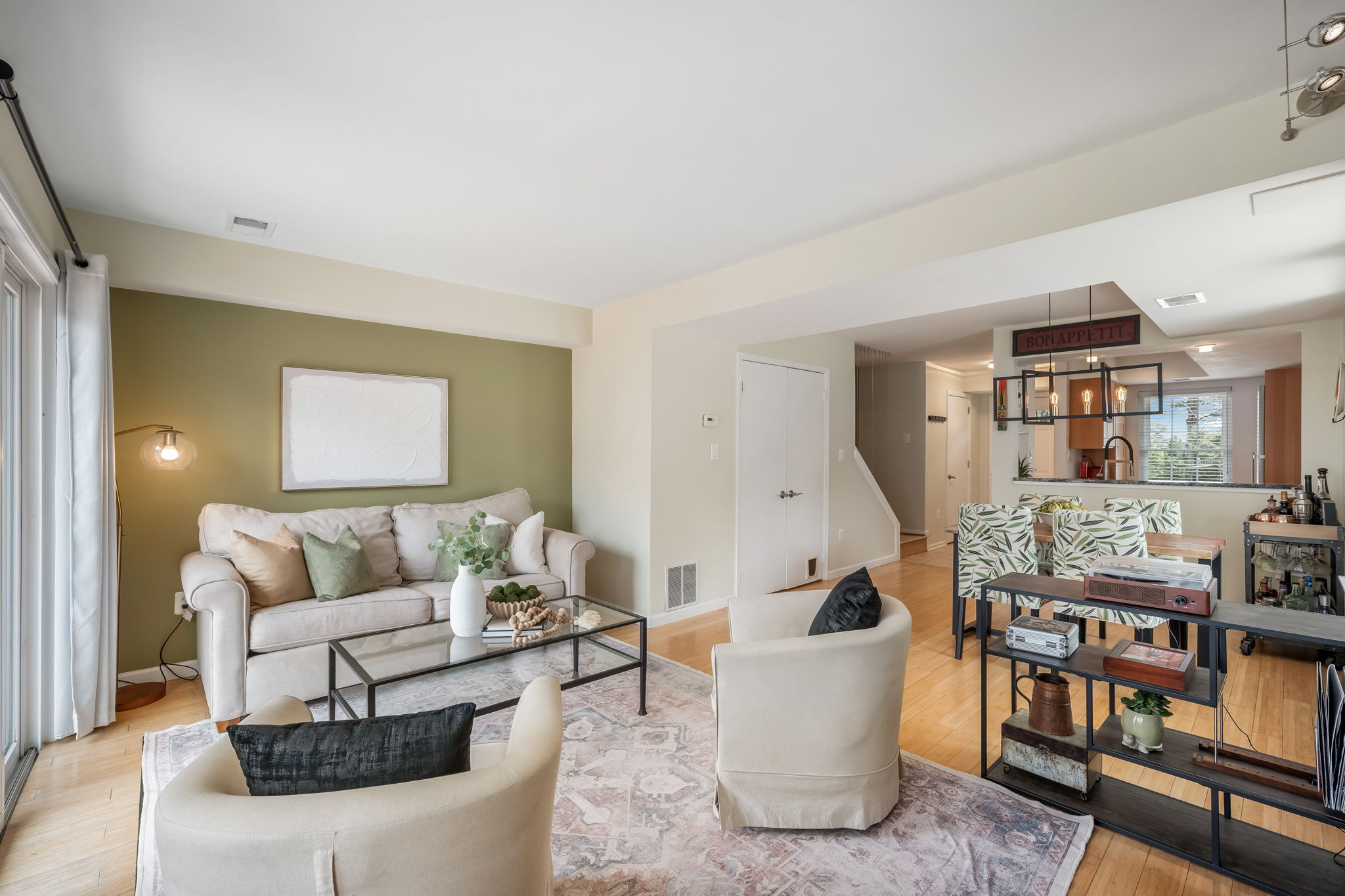Open Living Room w/modern fireplace & lake views!