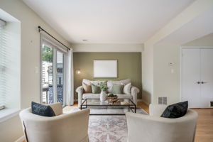 Open Living Room w/modern fireplace & lake views!