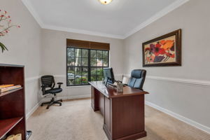 Office is perfectly situated in the front of home with nice window overlooking lush landscaping