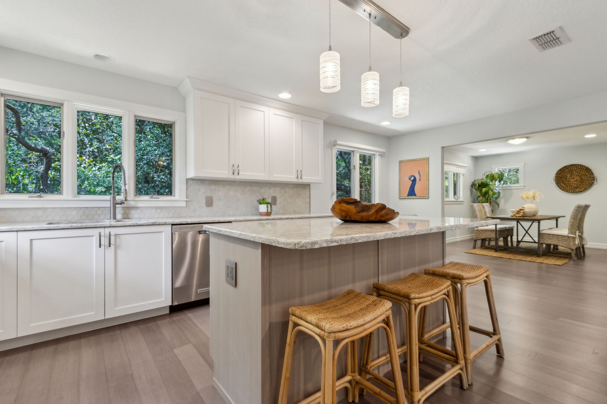 The flooring throughout the common area is a light grayish-brown engineered driftwood ...