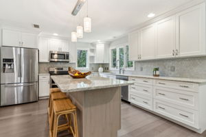 The kitchen was upgraded with new quartz counters ...