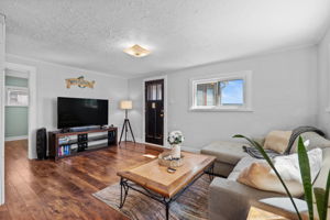 Wood style laminate flooring throughout