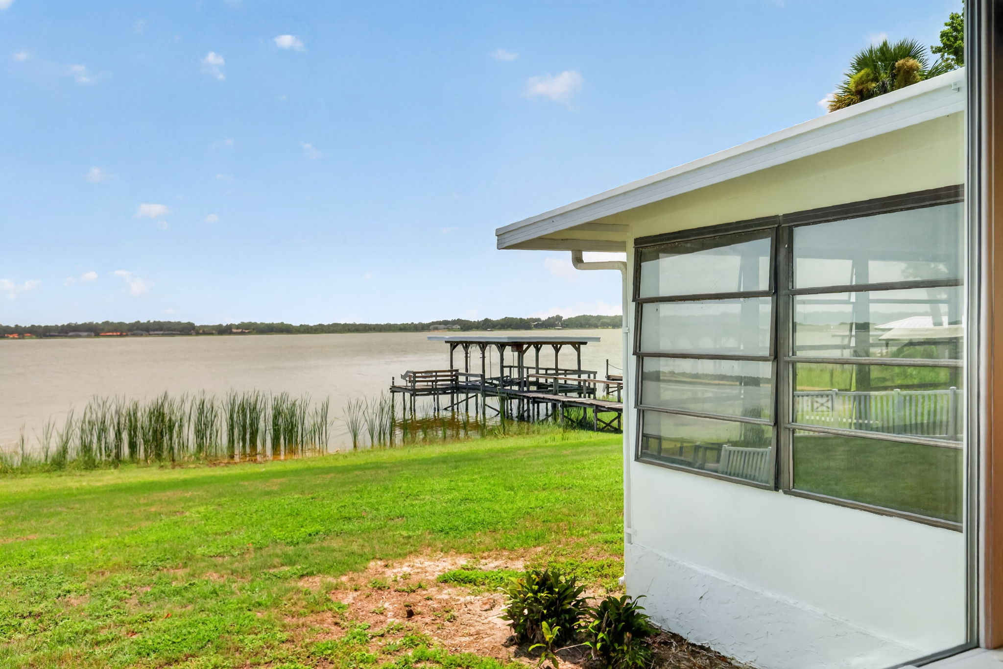 Large Rear and Side Yards with GORGEOUS WATERFRONT VIEWS of Lake Griffin!