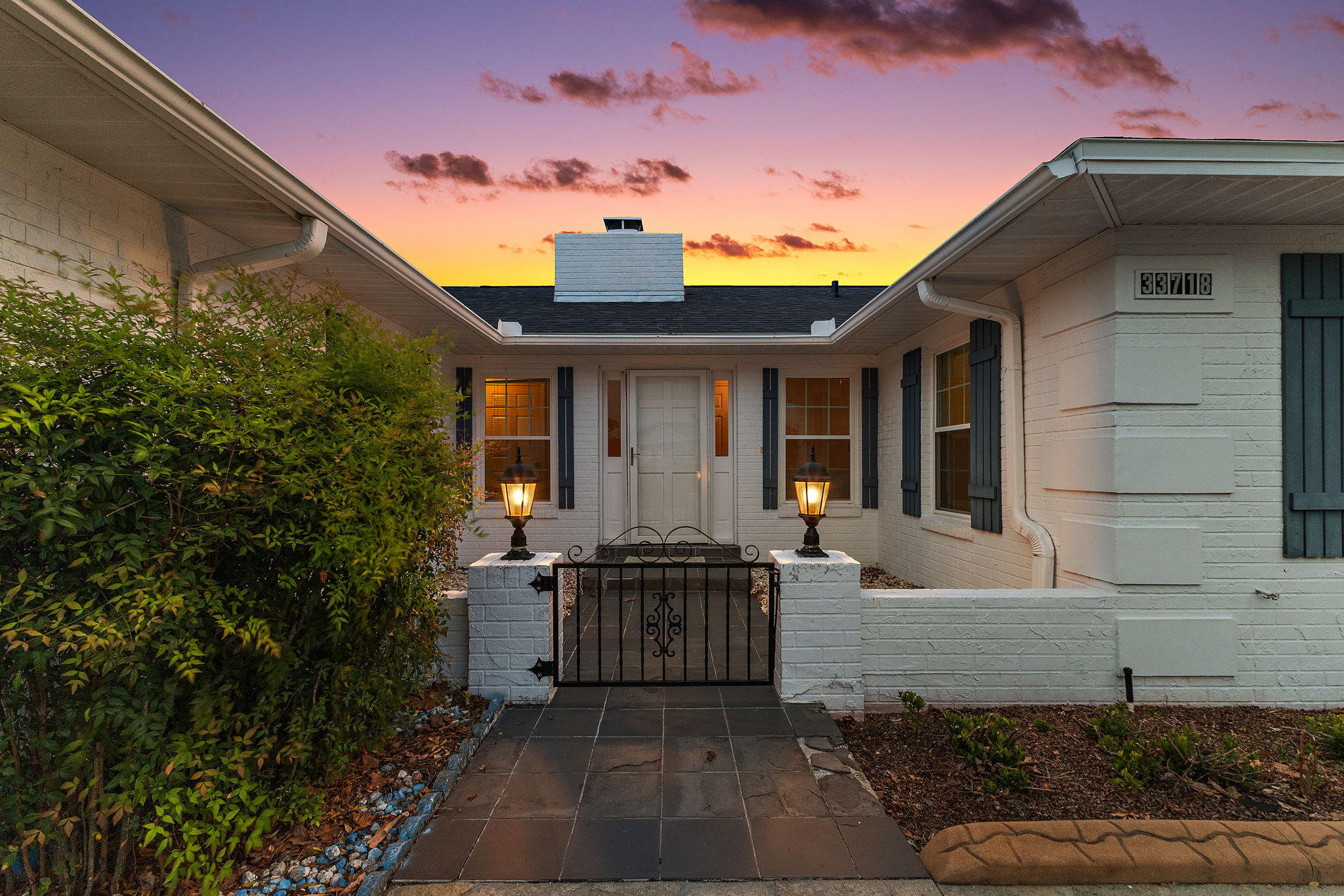 Twilight Gated Front Courtyard and Entry