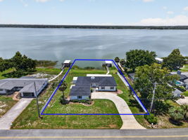 Aerial Front Elevation with Property Lines and INCREDIBLE WATERFRONT VIEWS of Lake Griffin!