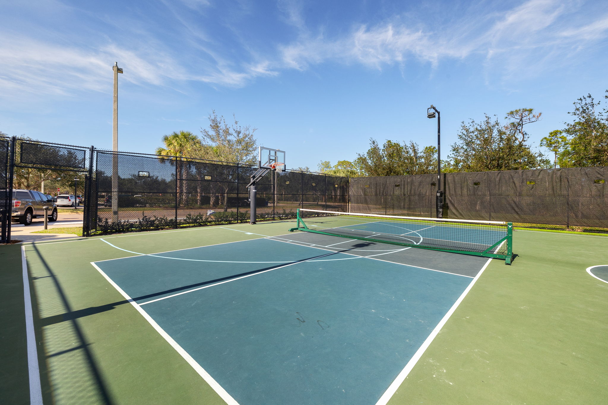 Outdoor Basketball court double as pickleball court.