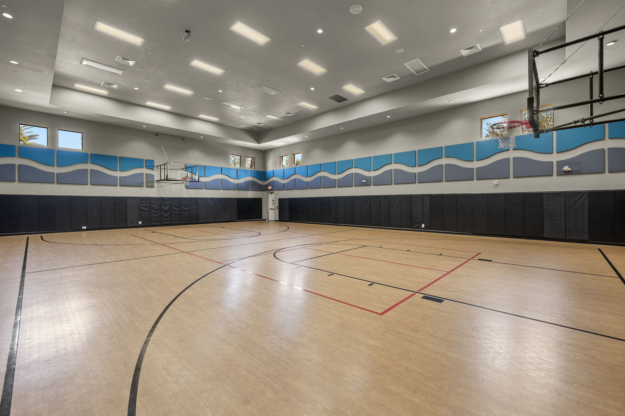 Indoor basketball court also has a pickleball net for additional pickle ball court...