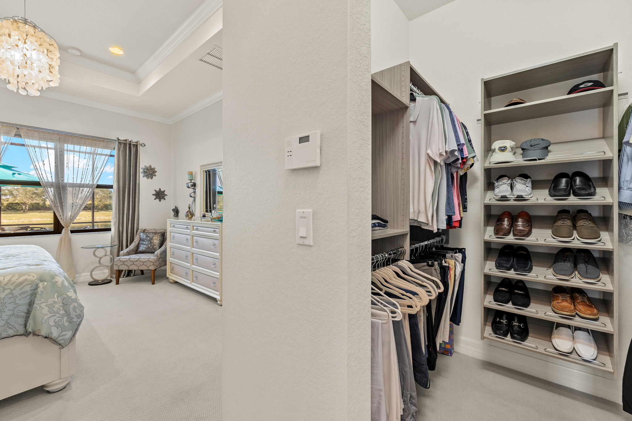 Built-ins you will LOVE in primary walk-in closet!