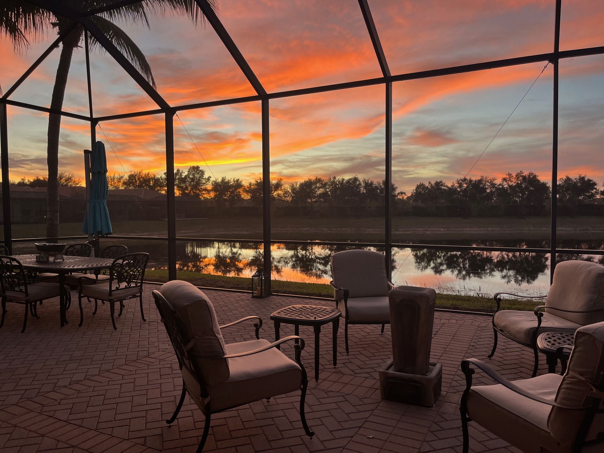 Lanai at sunset featuring a water view, too. Enjoy this daily!