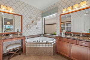 Corner garden tub, framed bathroom mirrors, dual vanities, make-up/vanity area a plus!