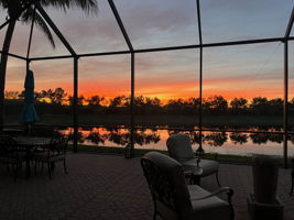 Lanai at sunset featuring a water view, too. Enjoy this daily!