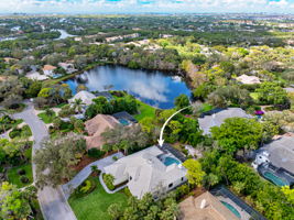 Aerial view captures the .5 of an acre site with privacy and side lake views
