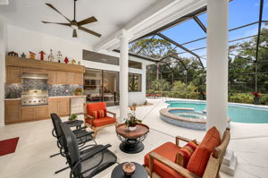 Outdoor Grill and sitting area is nicely under cover lanai.  Pool and spa has plenty of space for dining al fresco or lounging in the sun!
