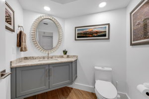 Powder room is designed tastefully and conveniently located off of the Living/Dining Room