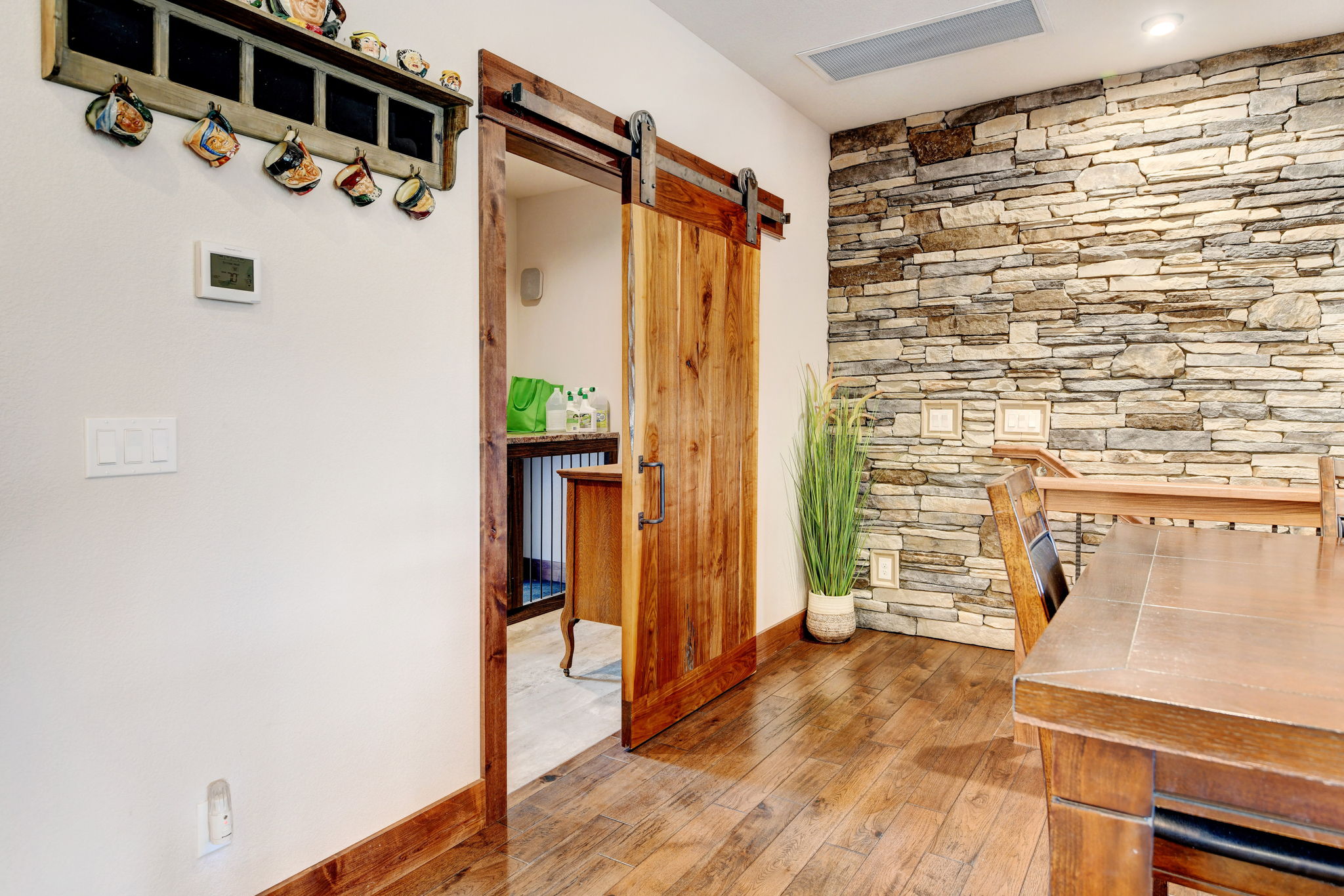 Main Level Laundry Room with Custom Solid Walnut Barn Door
