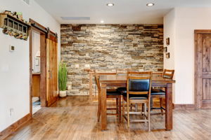 Stacked Stone Accent Wall in Dining Area