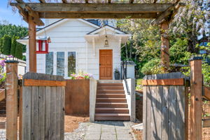 Wander through the wisteria-draped gate and be welcomed by a modern front deck, steel planters, and a sweet covered entry—then step inside this 101-year-old Beacon Hill gem, full of vintage character and timeless magic.