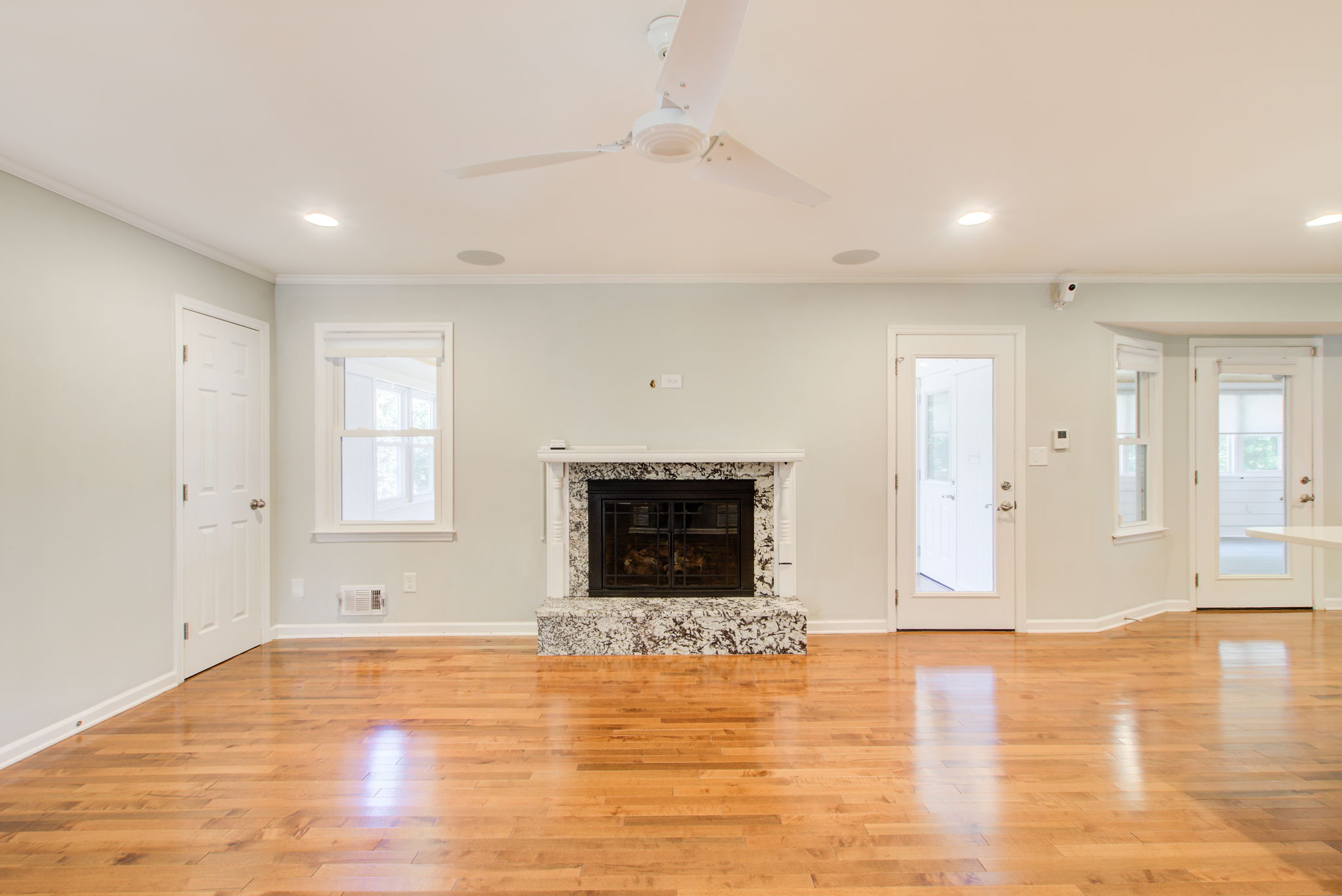 27 Living Room B Fireplace Detail w Sunroom + Sunporch Access