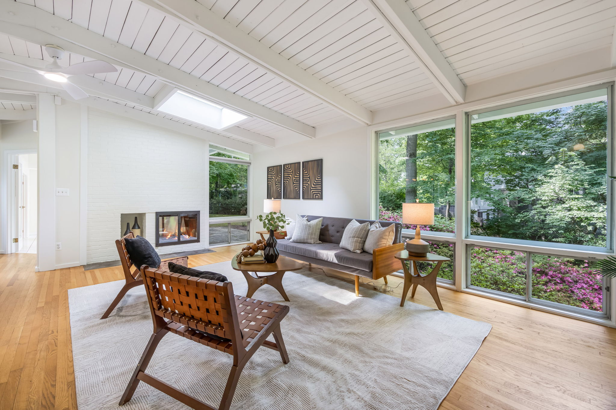 Open Living Room w/gas fireplace & skylight