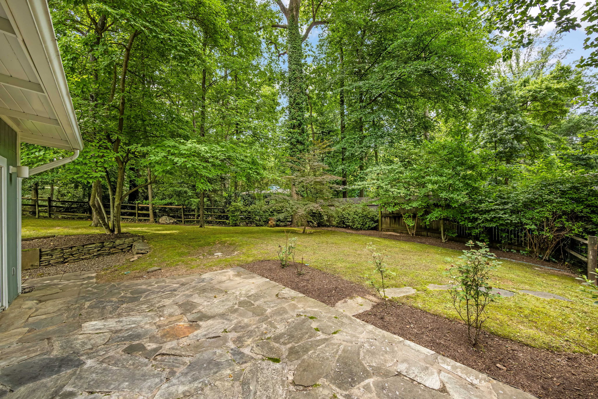 Nearly 1/2 acre private wooded lot w fenced bkyrd