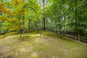 Nearly 1/2 acre private wooded lot w fenced bkyrd