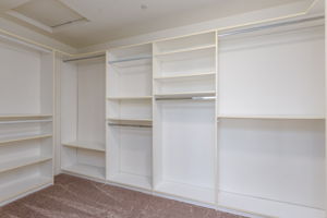 Expansive walk-in closet with organizers