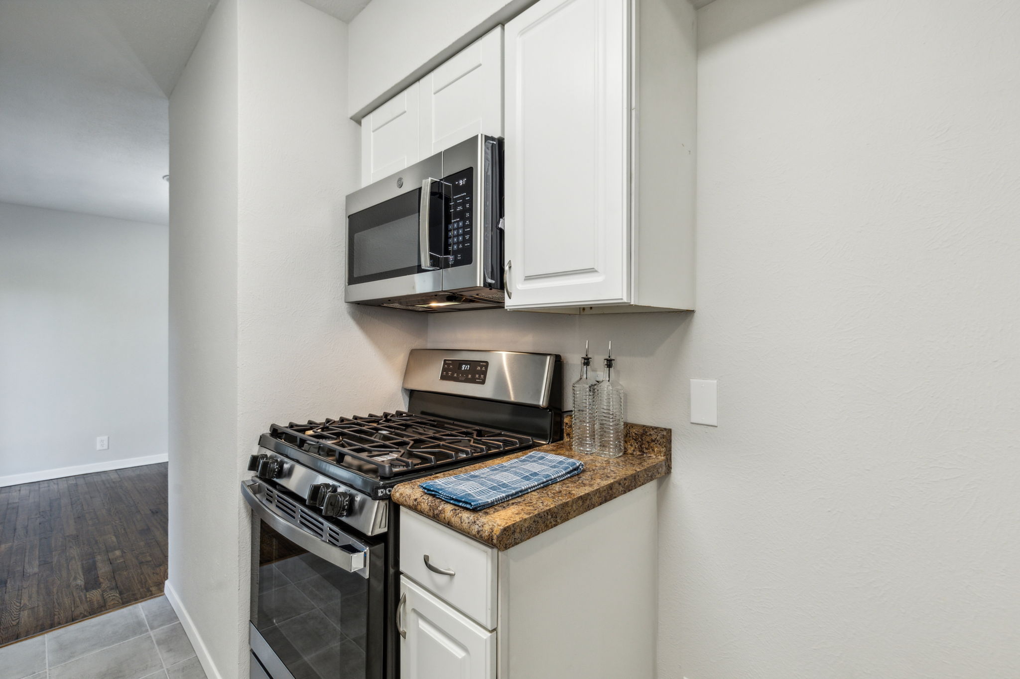 New Gas range and NEW microwave - all ready for the Holiday Baking!  Plenty of room for a refrigerator with available water line for an ice maker !