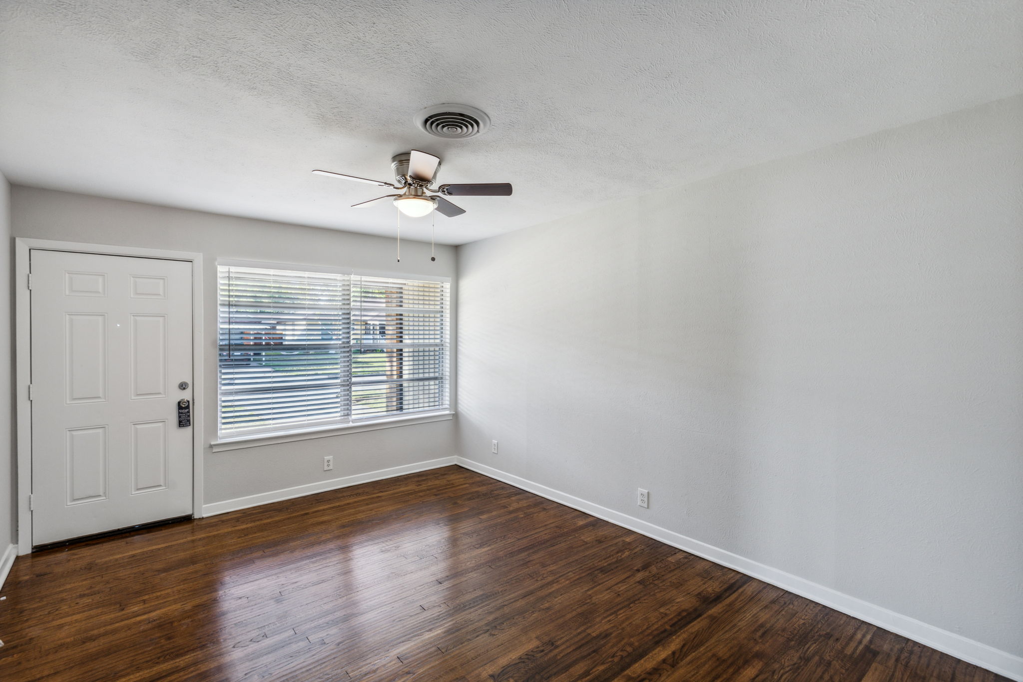 Welcome, please come in and check out the NEW features of this charming home!  The refinished  original wood flooring has been professionally restored with a warm and inviting rich color - just gorgeous!