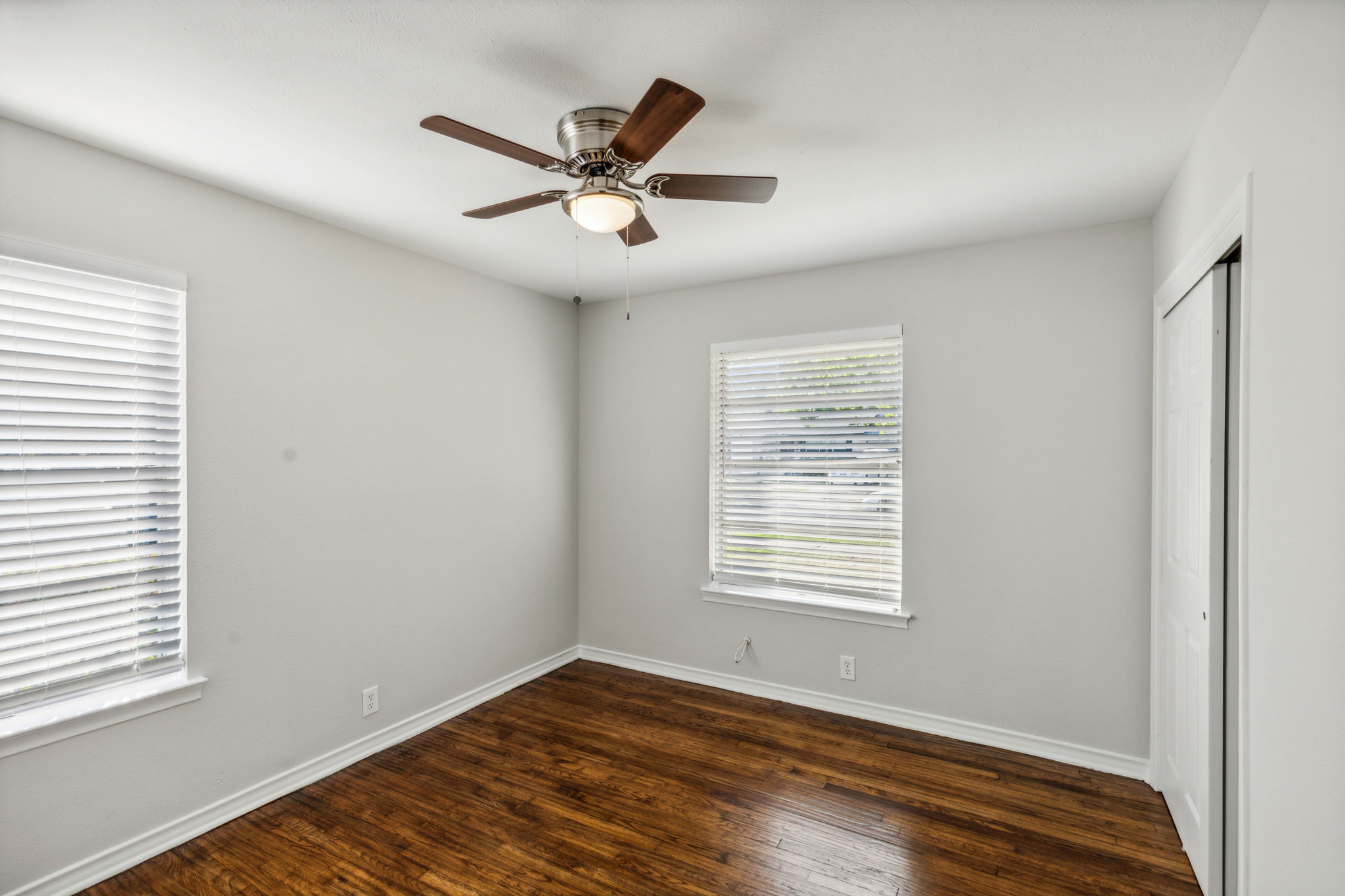 Bedroom #2 is spacious as well - boasting NEW Blinds, Ceiling Fan, Closet Doors, and Paint!