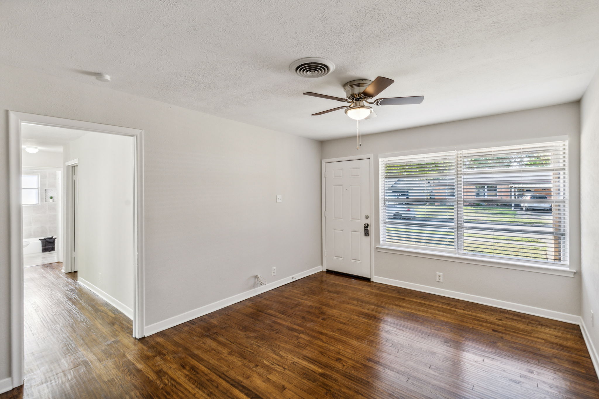 This beautiful home offers an open and bright  feel - NEW Ceiling fans throughout - Professionally painted with the latest colors - all NEW 2inch blinds, too!!