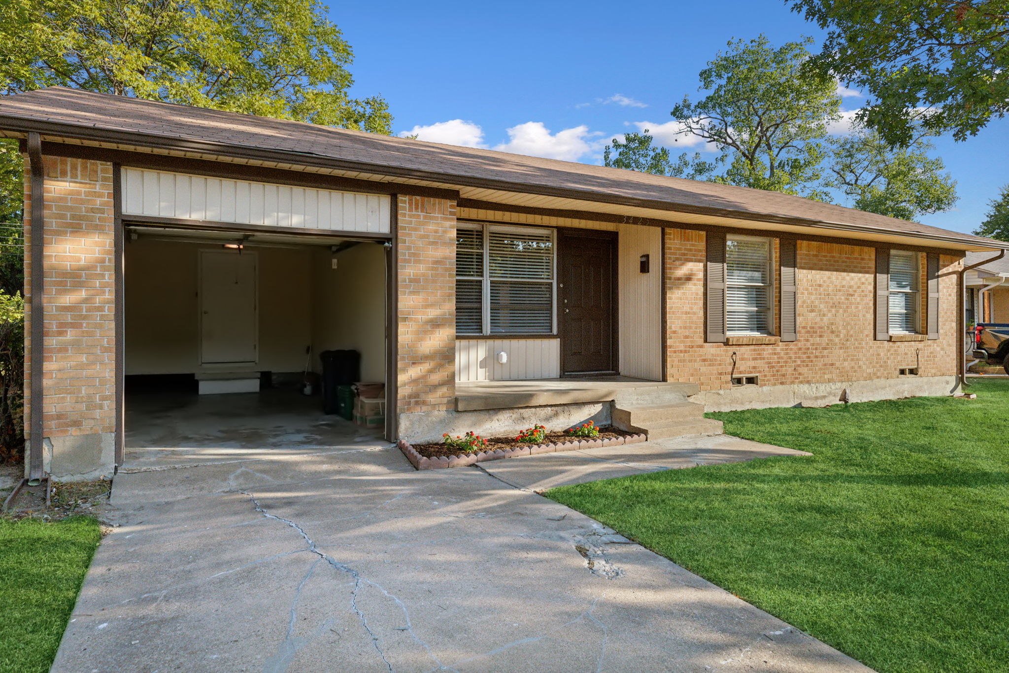 Roomy Garage space with entry door access to the laundry room.