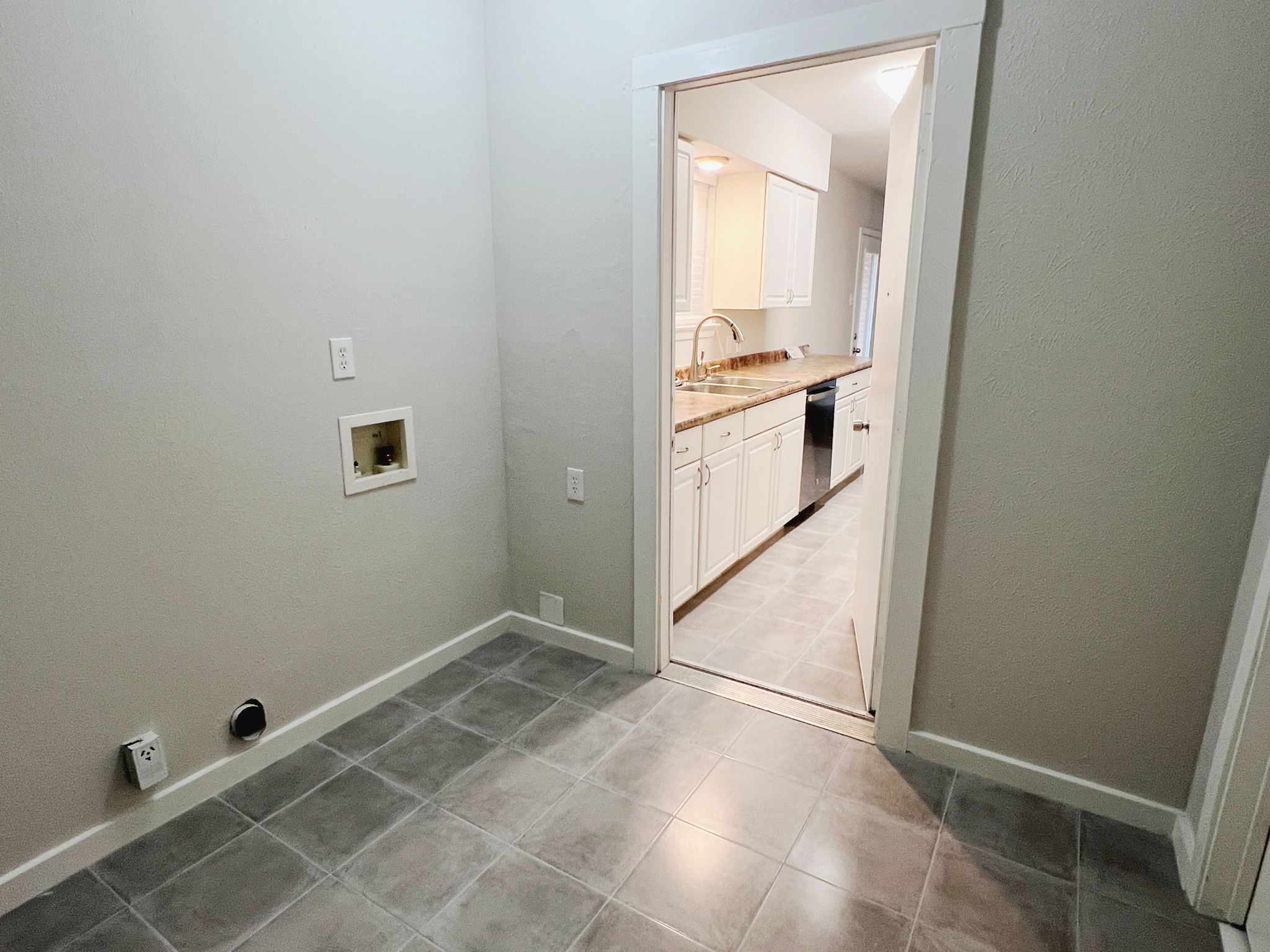 The Laundry Room is Conveniently Located right next to the kitchen!