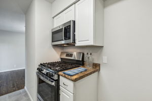 New Gas range and NEW microwave - all ready for the Holiday Baking!  Plenty of room for a refrigerator with available water line for an ice maker !