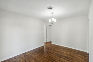 This view of the sizable dining area leads to the three bedrooms and guest bath!  NEW stylish Dining Room Light!