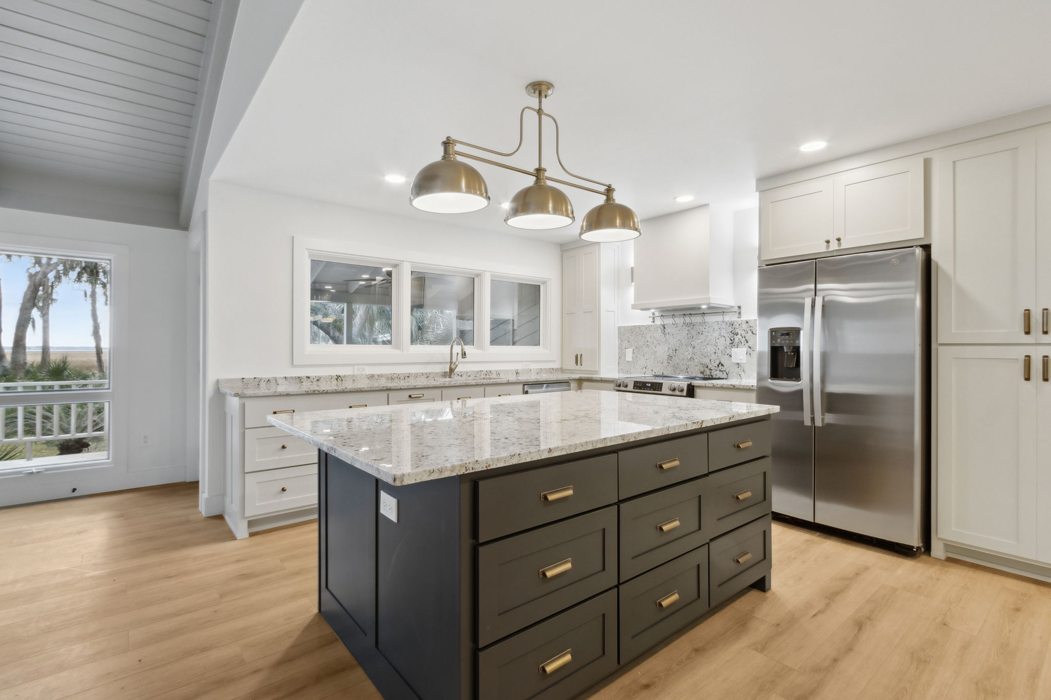 Kitchen boasts custom cabinetry...